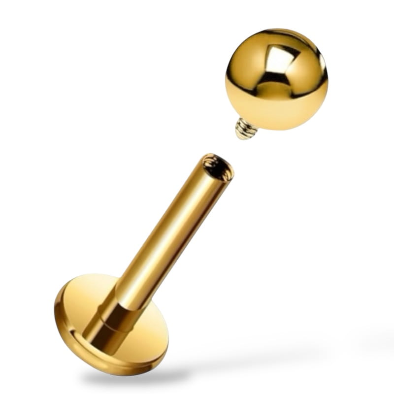 Tytanowy, złoty labret z gwintem wewnętrznym.